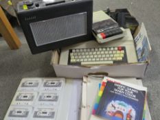 A Radio Shack TRS-80 colour computer with cassette player and games and accessories together with