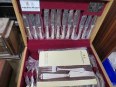 An unused Arthur Price Millennium canteen of cutlery in light oak effect box (unchecked)