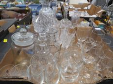 Two trays of cut glass to include decanters etc