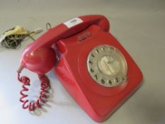 A vintage red telephone A/F