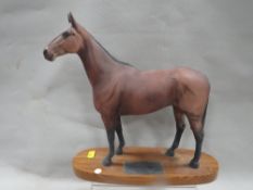 A Beswick figure of a horse on plinth - Arkle