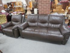 A two piece brown leather style suite