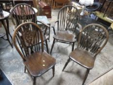 An oak refectory style table together with wheel back chairs