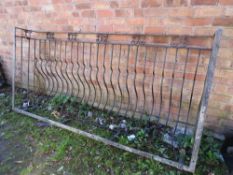 A heavy wrought iron Juliet balcony railing