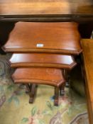 A reproduction nest of mahogany tables