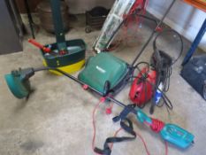 A selection of electrical gardening equipment to include a Bosch mower and strimmer, a boxed Black &