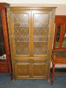 An oak old charm glazed leaded bookcase W 100 cm