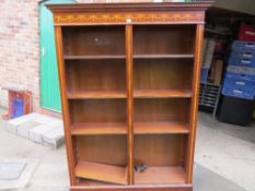 A reproduction mahogany double tall bookshelf with inlaid detail