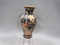 A small Oriental vase with black ground Japanese style script panels with three toed dragon above,