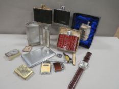 A box of hip flasks, cigarette lighters, watch etc