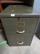 A vintage two door locking filing cabinet