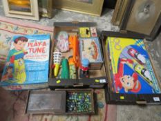 Two trays of vintage toys to include tug boat, marbles, Chad Valley Play a Tune, Scalextric etc