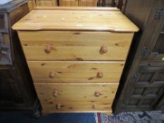 A modern honey pine four drawer chest together with a fire screen (2)