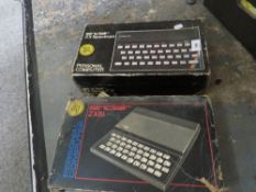 Two vintage Sinclair boxed computers