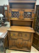 A reproduction oak glazed carved dresser