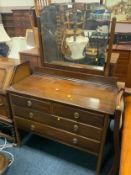 An Edwardian mahogany four drawer dressing table