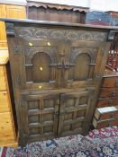 A carved oak drinks cabinet W 94 cm