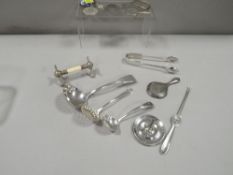 A small tray of collectable silver and plated ware to include a small hallmarked silver ladle,