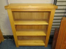 A modern light oak open bookcase H 109 cm W 89 cm