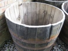 A very large half barrel oak garden planter
