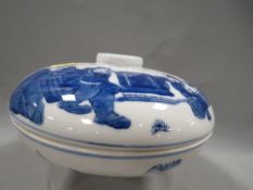 A Chinese style six section blue/white low bowl with cover with six character mark to lid