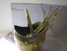 A brass helmet coal scuttle with companion items