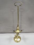 An antique brass Lucerne standing lamp