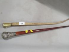 A silver mounted malacca walking cane and silver gilt mounted pizzle stick by Brigg (2)