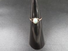 A yellow metal ring set with opal approx. weight 0.9g