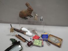 A small box of collectables, to include vintage advertising matchbooks, a German pipe etc