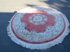 A modern oval Chinese woollen rug