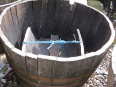 A very large half barrel oak garden planter