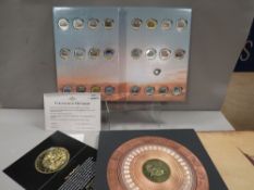 A cased frieze of the American history together with a coin collection of aviation to include 1 0.5g