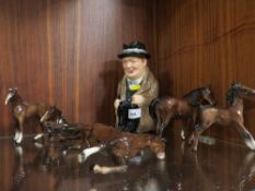 A Royal Doulton Winston Churchill toby jug together with a selection of Beswick horses A/F