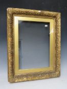 A 19TH CENTURY GOLD FRAME, with gold slip and outer leaf design, glazed, with some restoration,