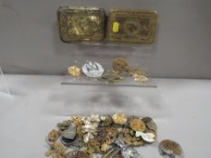 Two military Christmas tins with a bag of badges etc