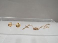 A hallmarked 9 carat gold crucifix on chain together with earrings stamped 375 approx. weight 4.4g