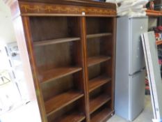 A reproduction mahogany double tall bookshelf with inlaid detail