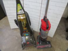 A Bissell carpet cleaner and a Vax upright vacuum cleaner