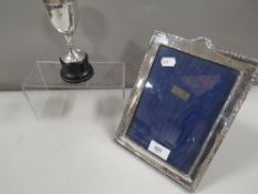 A silver hallmarked photo frame and trophy