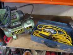 A small hobbyist air compressor together with a 110V hand drill