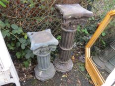 Two plastic planter plinths