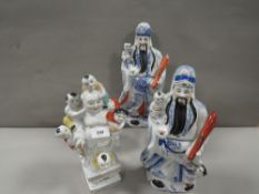 Three Oriental figures