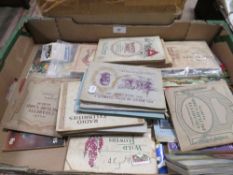 A box of early cigarette card albums