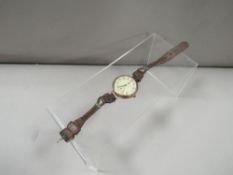 An Elgin 10ct gold watch