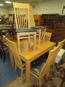 A modern light oak extending dining table and six chairs