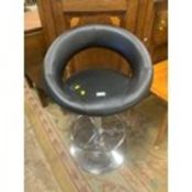 A modern swivel bar stool