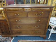 A large 19th century mahogany five drawer chest of drawers with two secret drawers W 142 cm