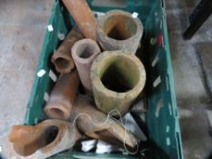A tray of terracotta pipes - tray not included