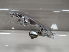 A vintage Jaguar car mascot